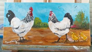 Le coq, sa poule et leurs poussins.
