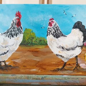 Le coq, sa poule et leurs poussins.
